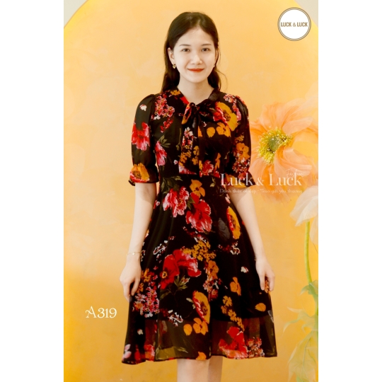 Đầm xòe hoa ngực nơ 